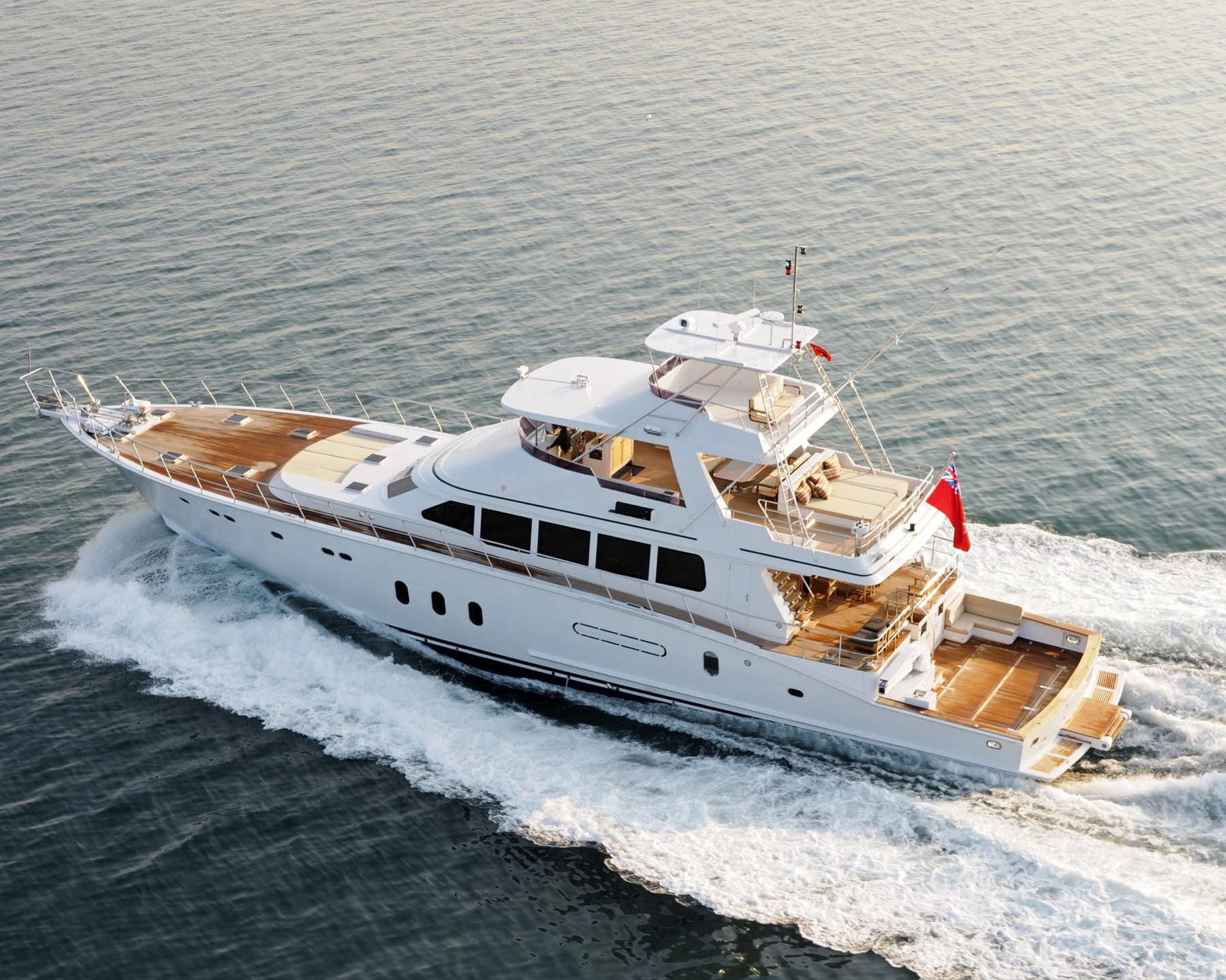 White motor yacht underway, seen from above